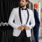 Tuxedo Blanco con solapa negro de un solo boton, es utilizado en forma clasica con gatito y fajon.
